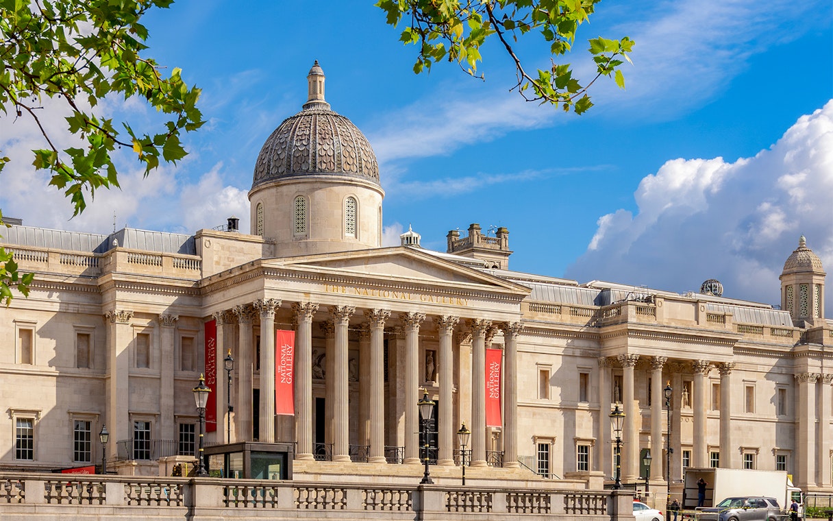 National Gallery London exterior with dome and columns under blue sky.