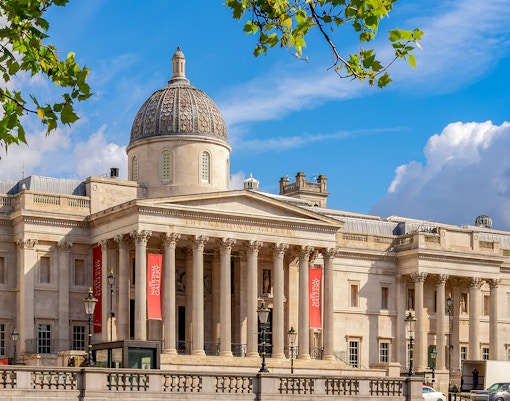 National Gallery London exterior with dome and columns under blue sky.