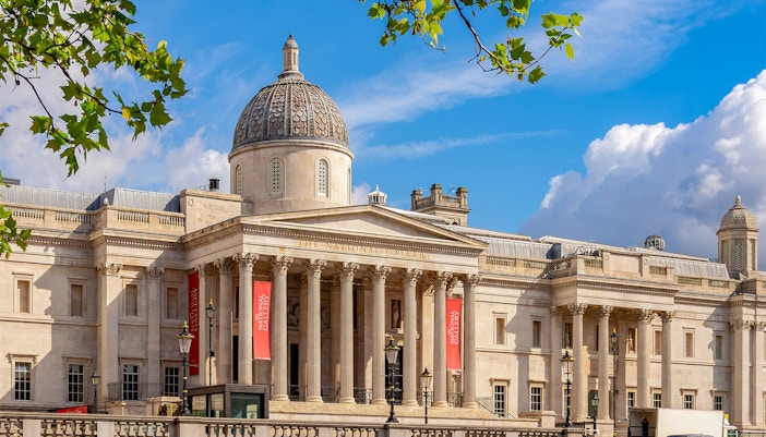 National Gallery London exterior with dome and columns under blue sky.