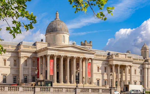 National Gallery London exterior with dome and columns under blue sky.