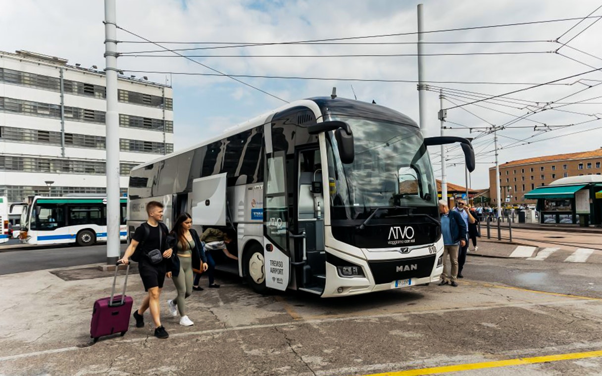 Passengers boarding ATVO airport transfer bus in Venice.