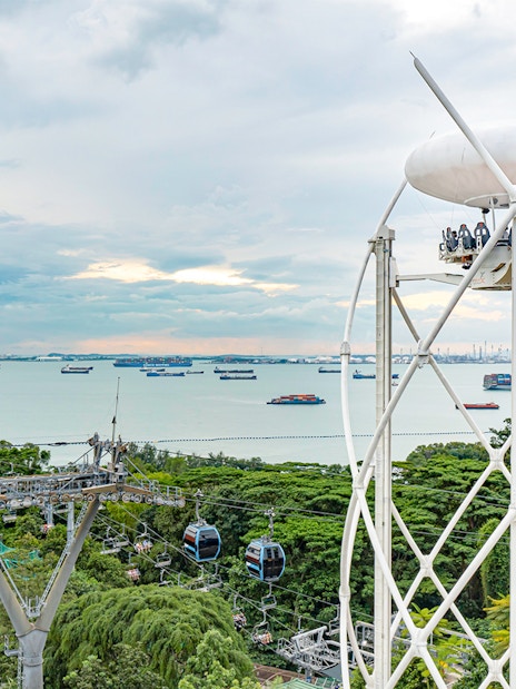 SkyHelix Sentosa ride with panoramic views of Singapore's coastline and cable cars.