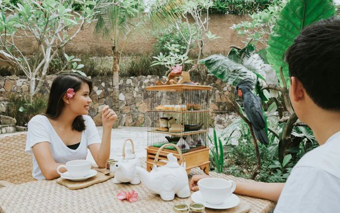 Lunch setting at Lombok Wildlife Park with bird interaction.