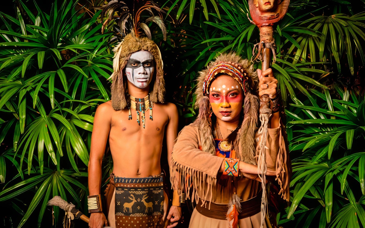Performers in traditional costumes at Sunway Lagoon Night Park.