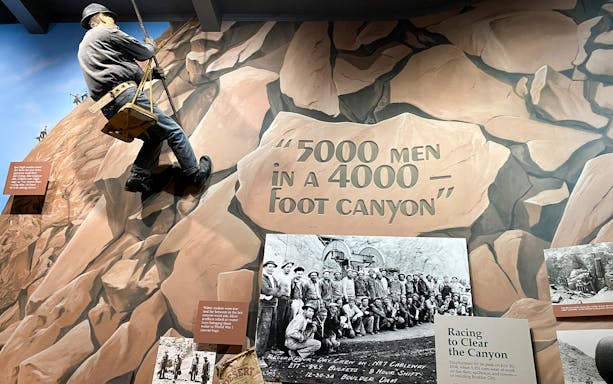 Hoover Dam worker mural and historical photo exhibit at Boulder City and Hoover Dam Museum.