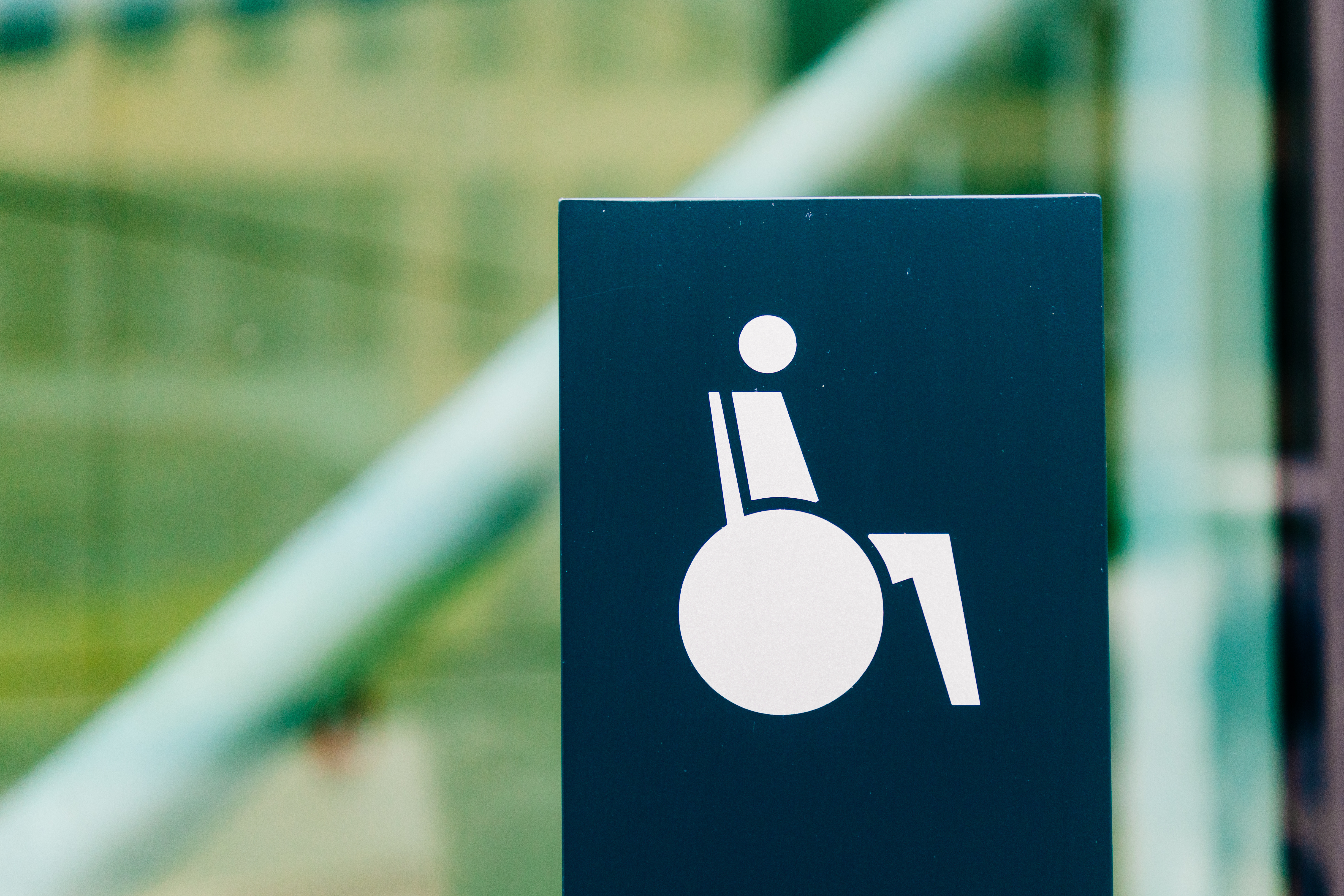 Wheelchair access sign indicating barrier-free entrance in a public area.