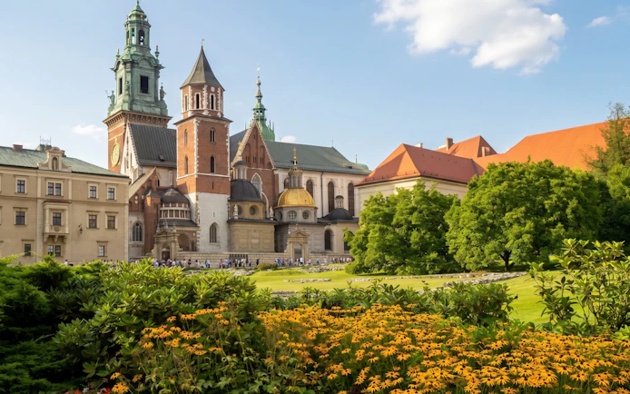 Wawel Castle and Cathedral in Krakow with gardens in the foreground.
