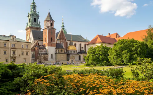 Wawel Castle and Cathedral in Krakow with gardens in the foreground.