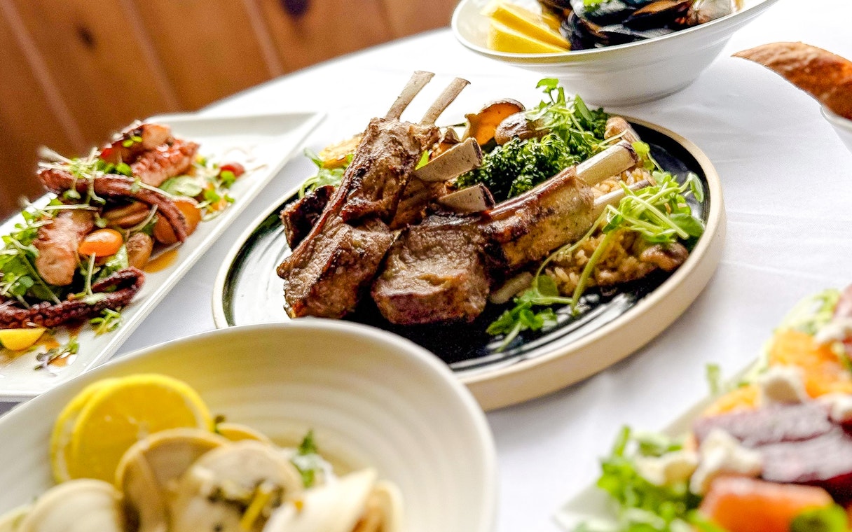 Lamb chops and seafood dishes on New Year's Eve Dinner Cruise.