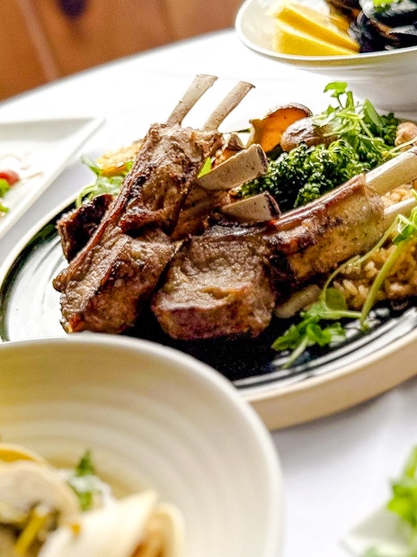 Lamb chops and seafood dishes on New Year's Eve Dinner Cruise.