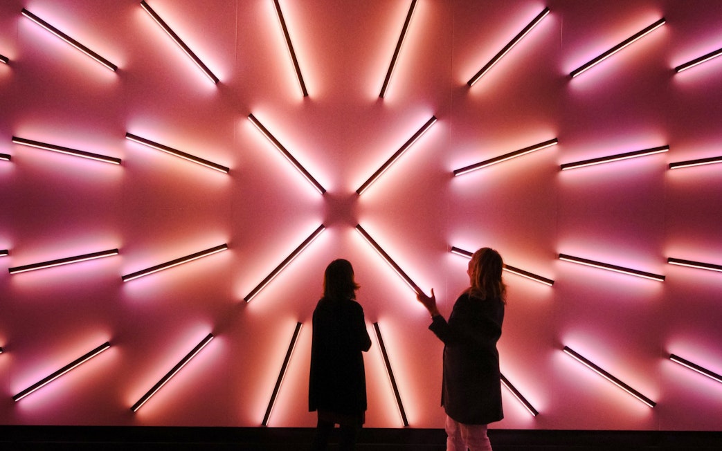 Guests viewing illuminated art installation at Signal Space Digital Art Gallery.
