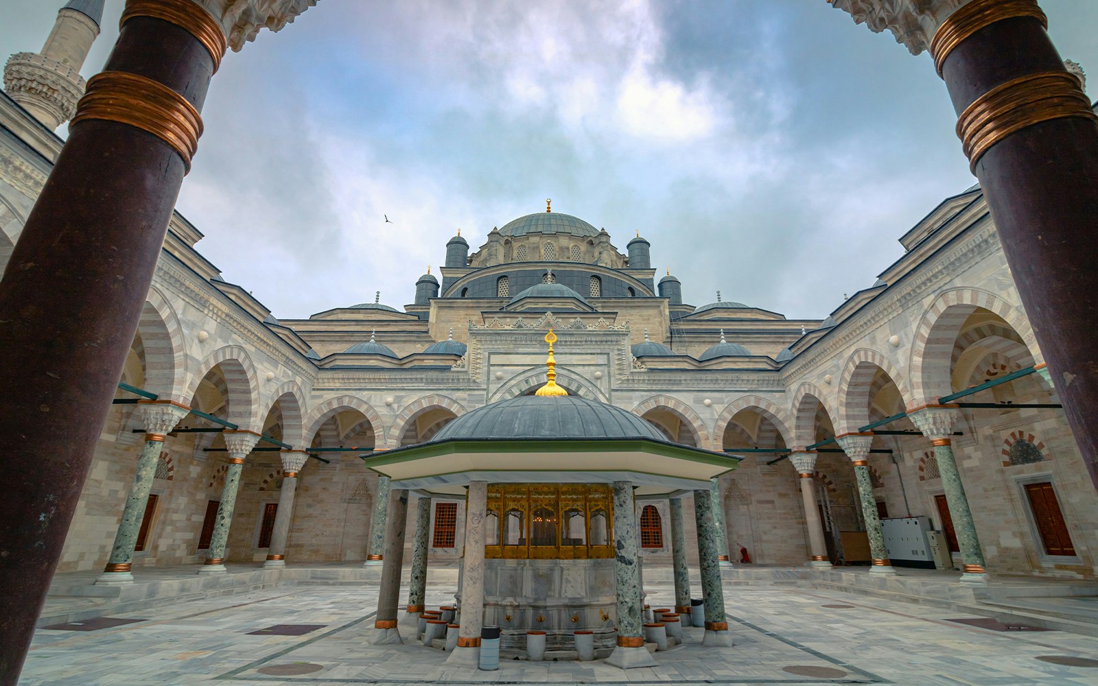 Courtyard of Suleymaniye Mosque with domes and arches, Istanbul tour.