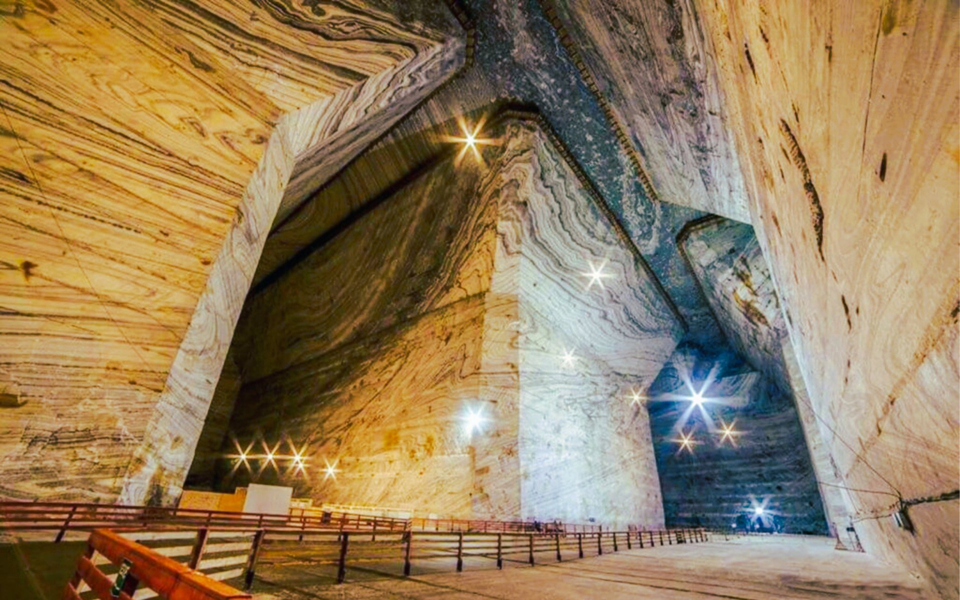 Interior view of Slanic Salt Mine with illuminated cavern walls and pathways.