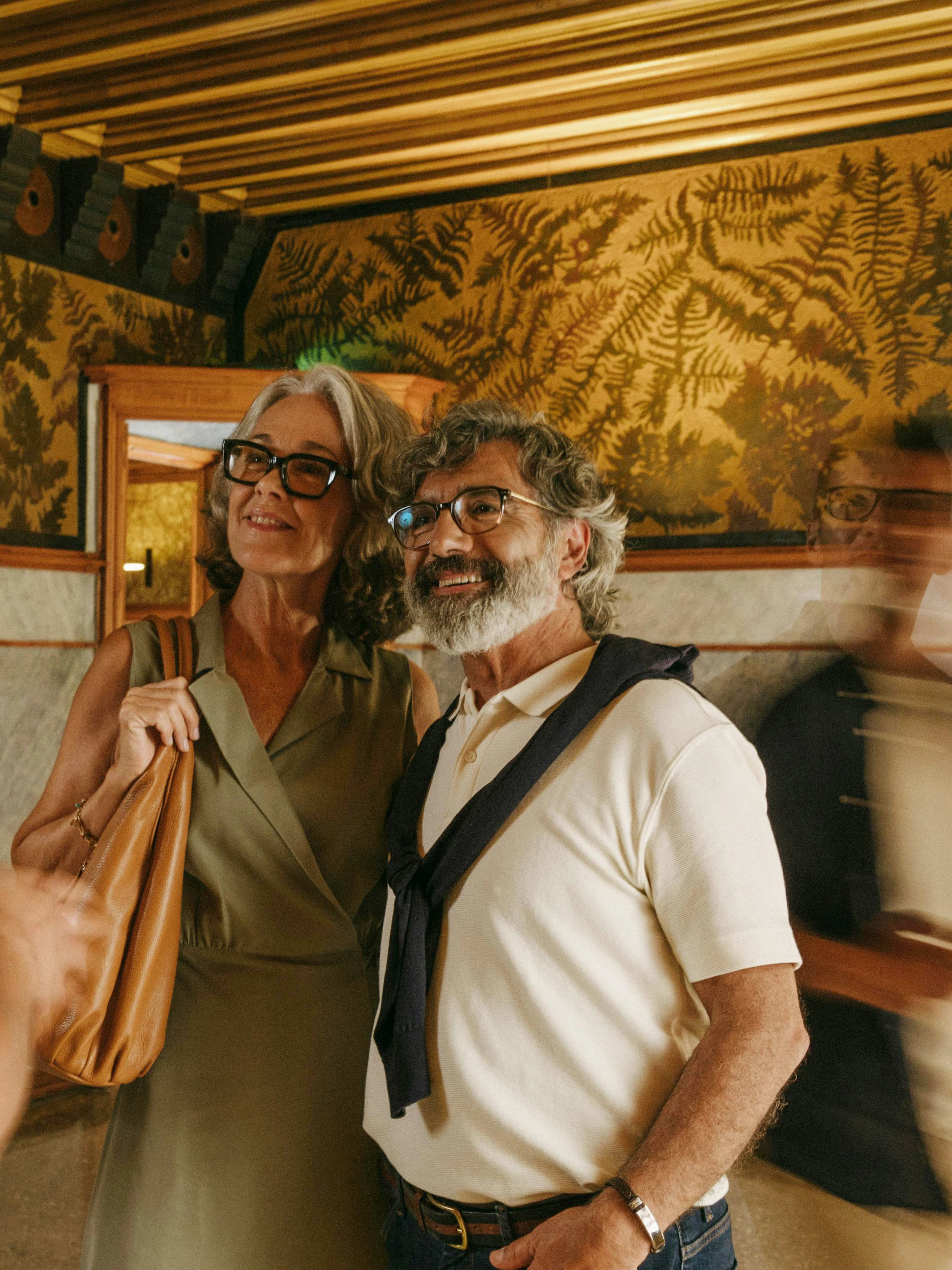 Tour group inside Casa Vicens, Barcelona, with guide explaining wall art.