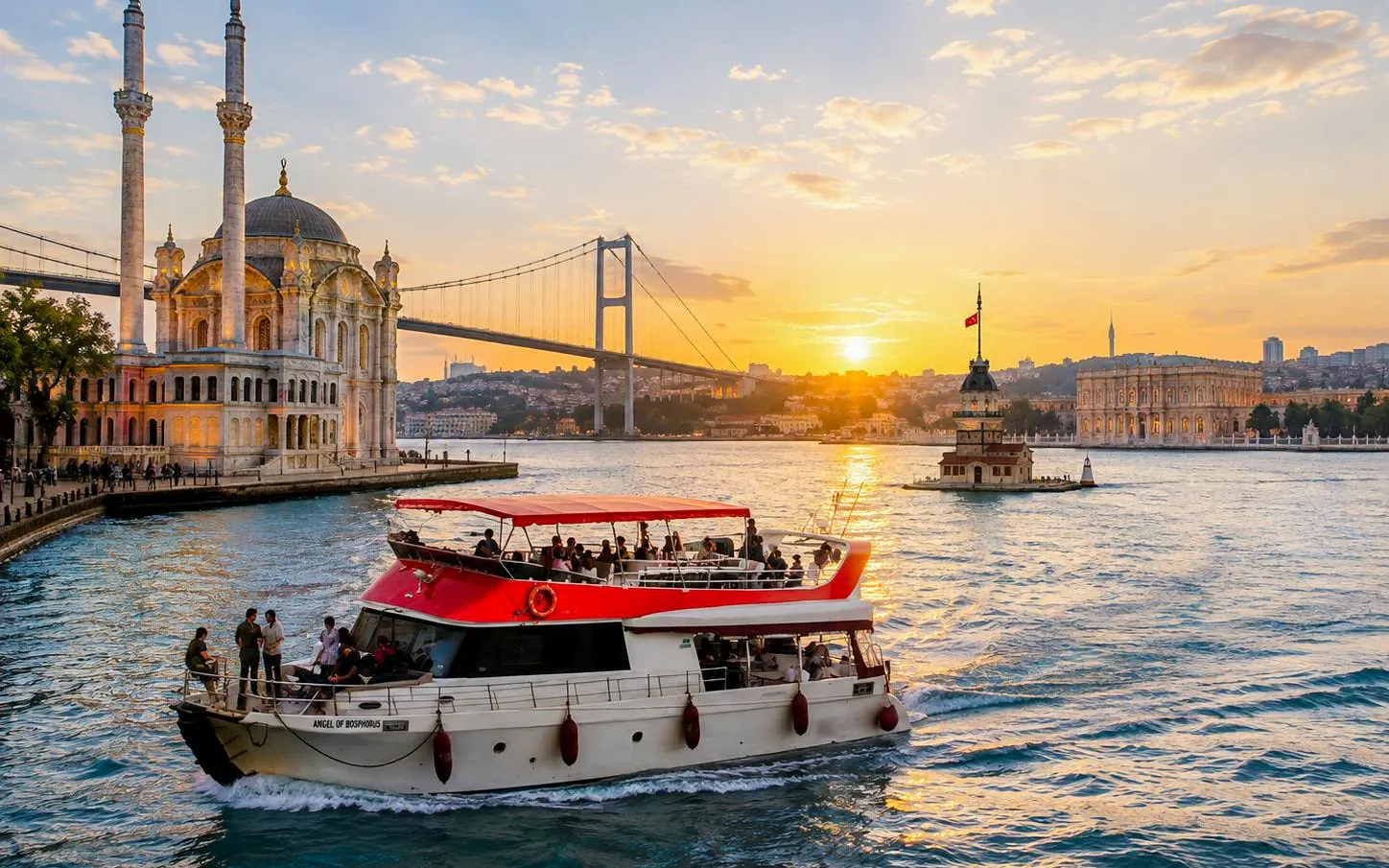 Ortaköy Mosque and yacht on Bosphorus during sunset cruise, Istanbul.