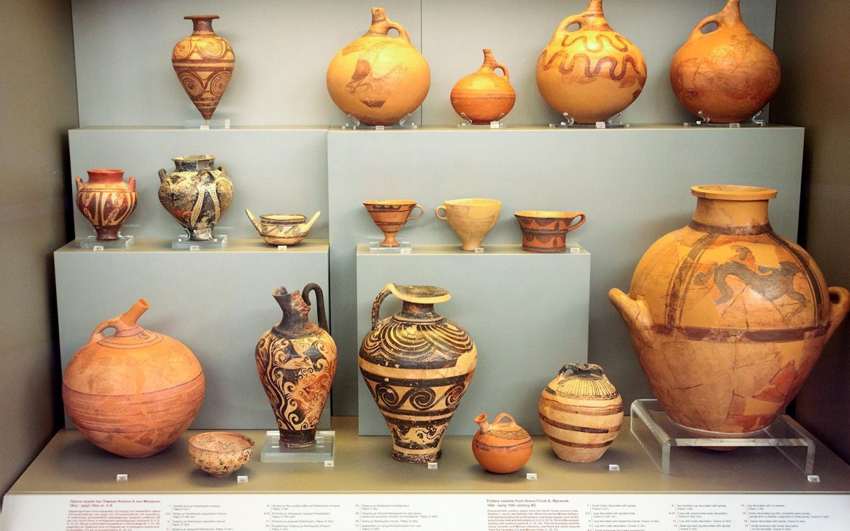 Ancient pottery display at Mycenae archaeological museum.