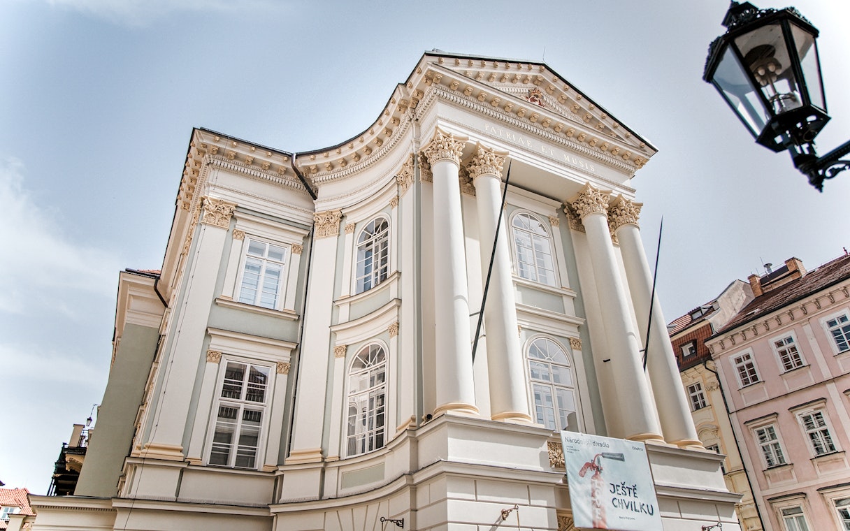 Prague Old Town historic building with classical columns and ornate details.