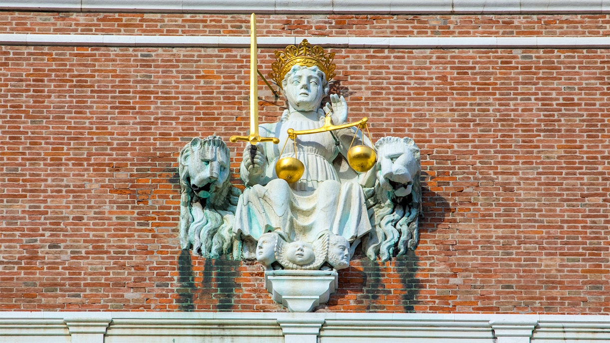 Allegorical figure of Venice as Justice near St. Mark's Bell Tower, Venice, Italy.