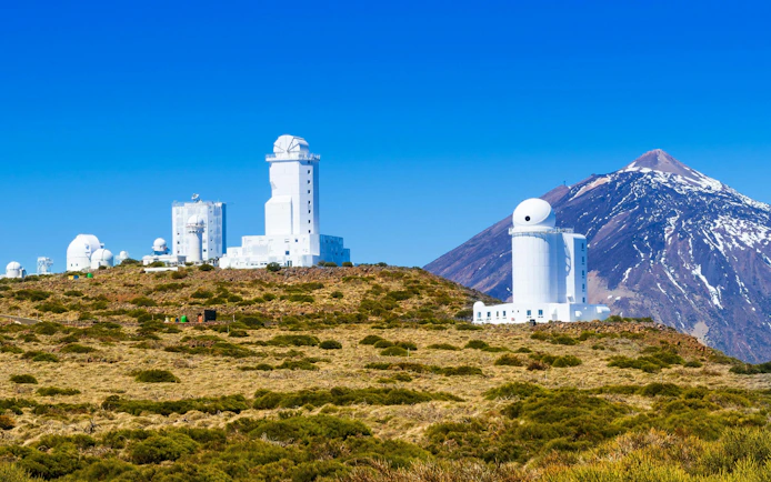 Telescopes at Izana Observatory with Teide Volcano in winter, Tenerife, Canary Islands, Spain.