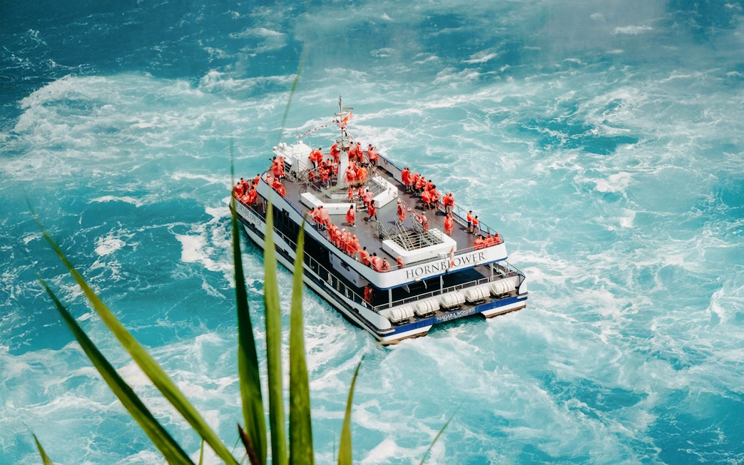 Hornblower Niagara City Cruise boat navigating near Niagara Falls.