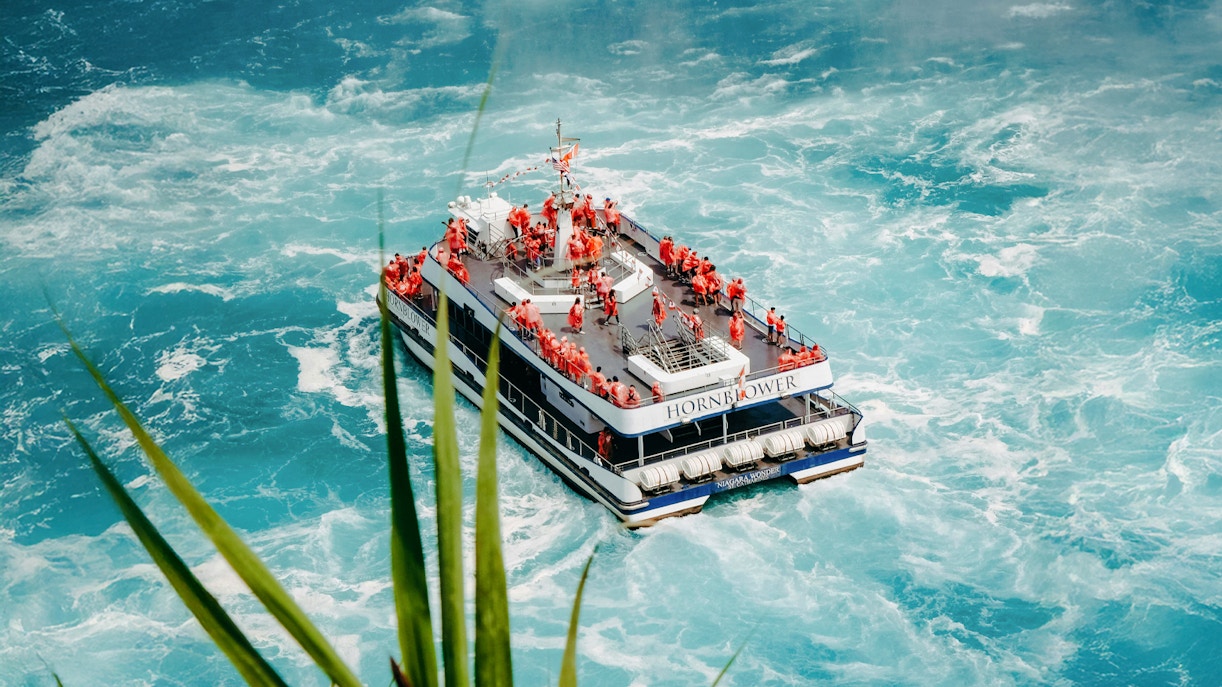 Hornblower Niagara City Cruise boat navigating near Niagara Falls.