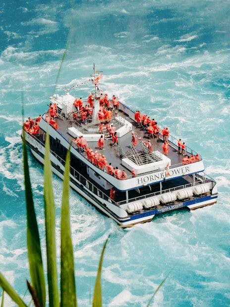 Hornblower Niagara City Cruise boat navigating near Niagara Falls.