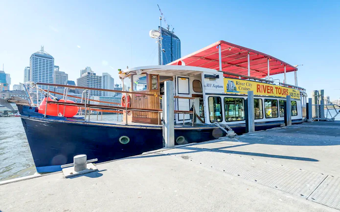 MV Neptune tour boat docked in Brisbane for River City Cruises.