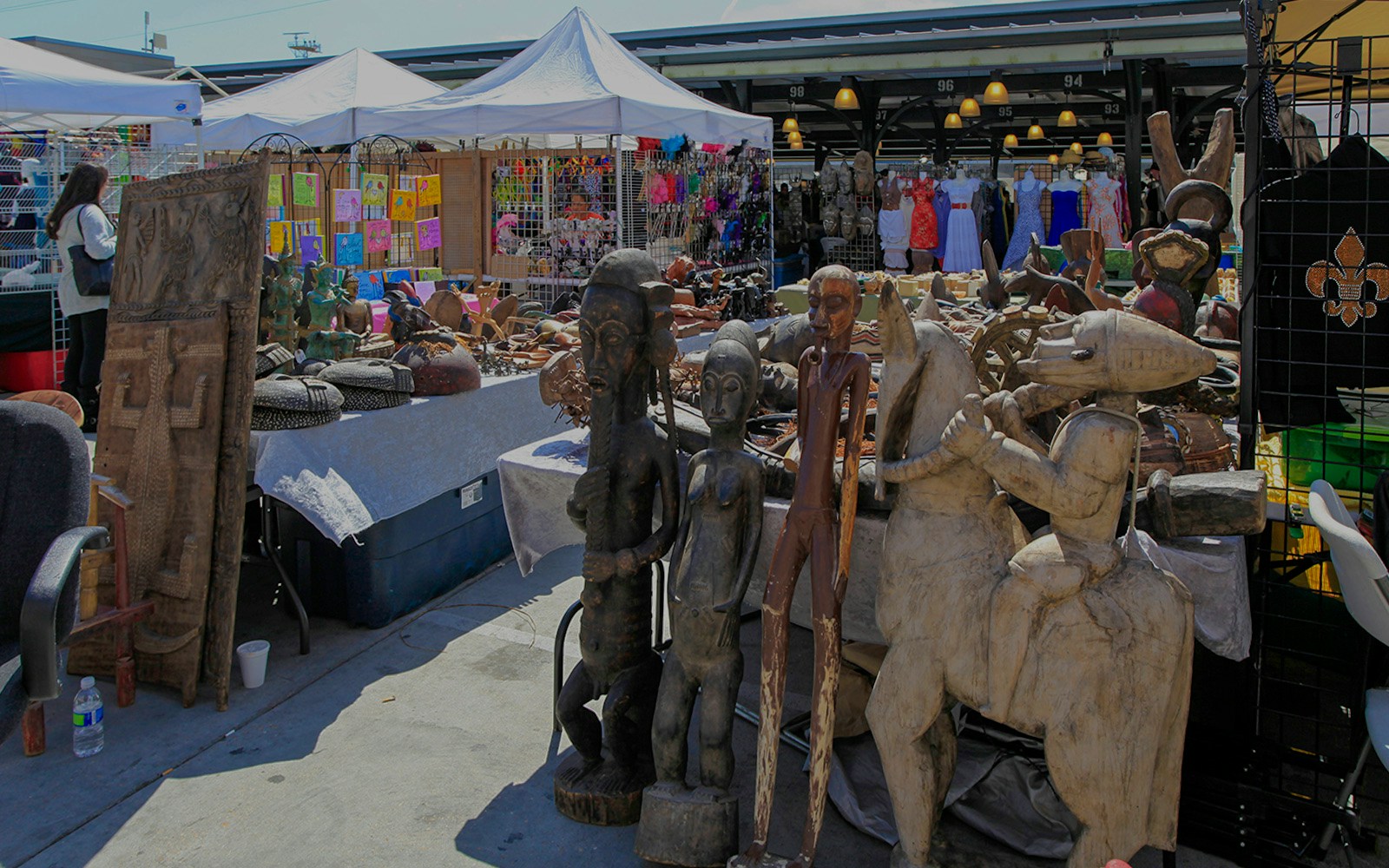Outdoor stalls with African sculptures and crafts at French Market, New Orleans.
