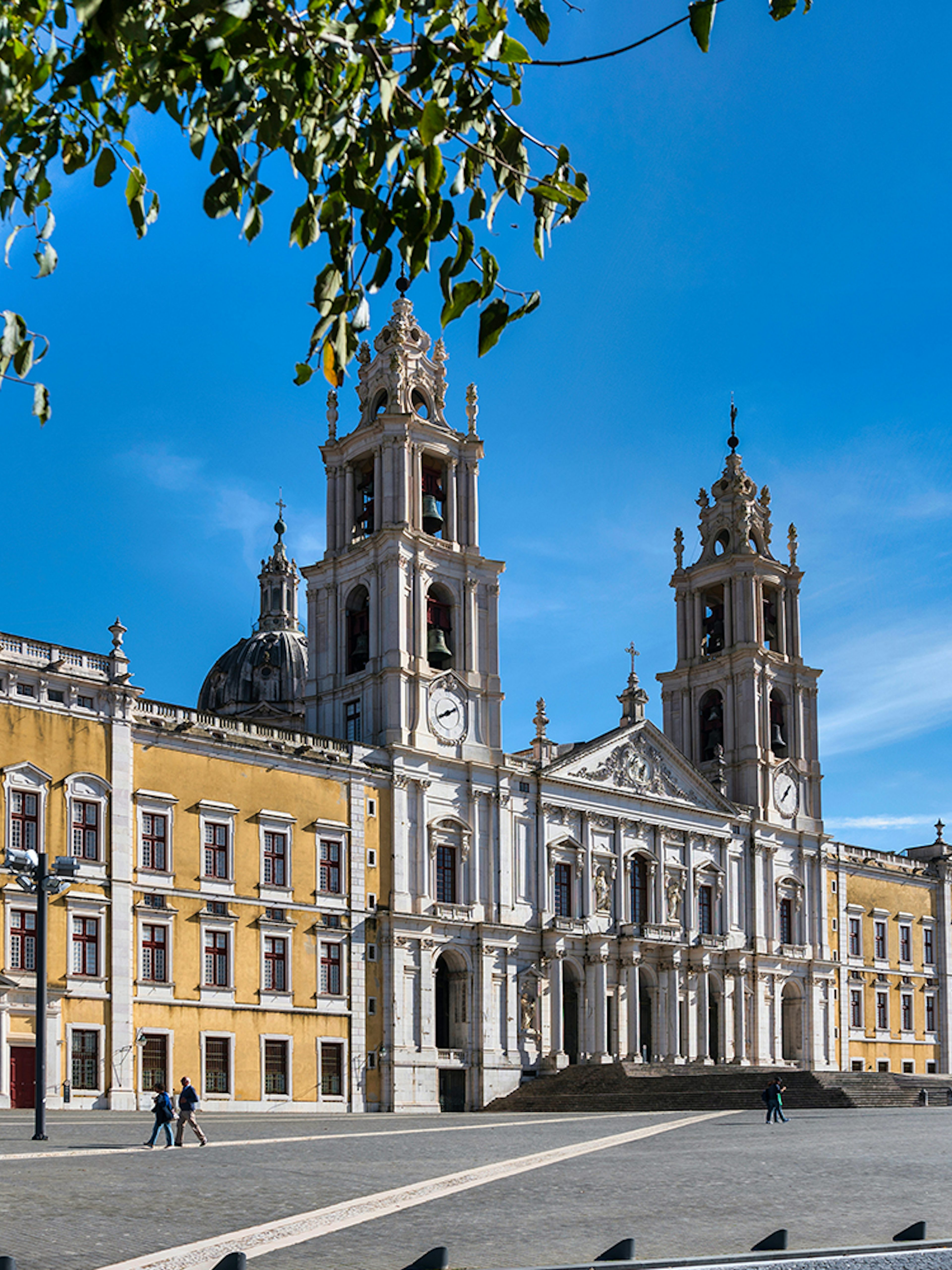 Mafra National Palace facade with twin bell towers in Mafra, Portugal.