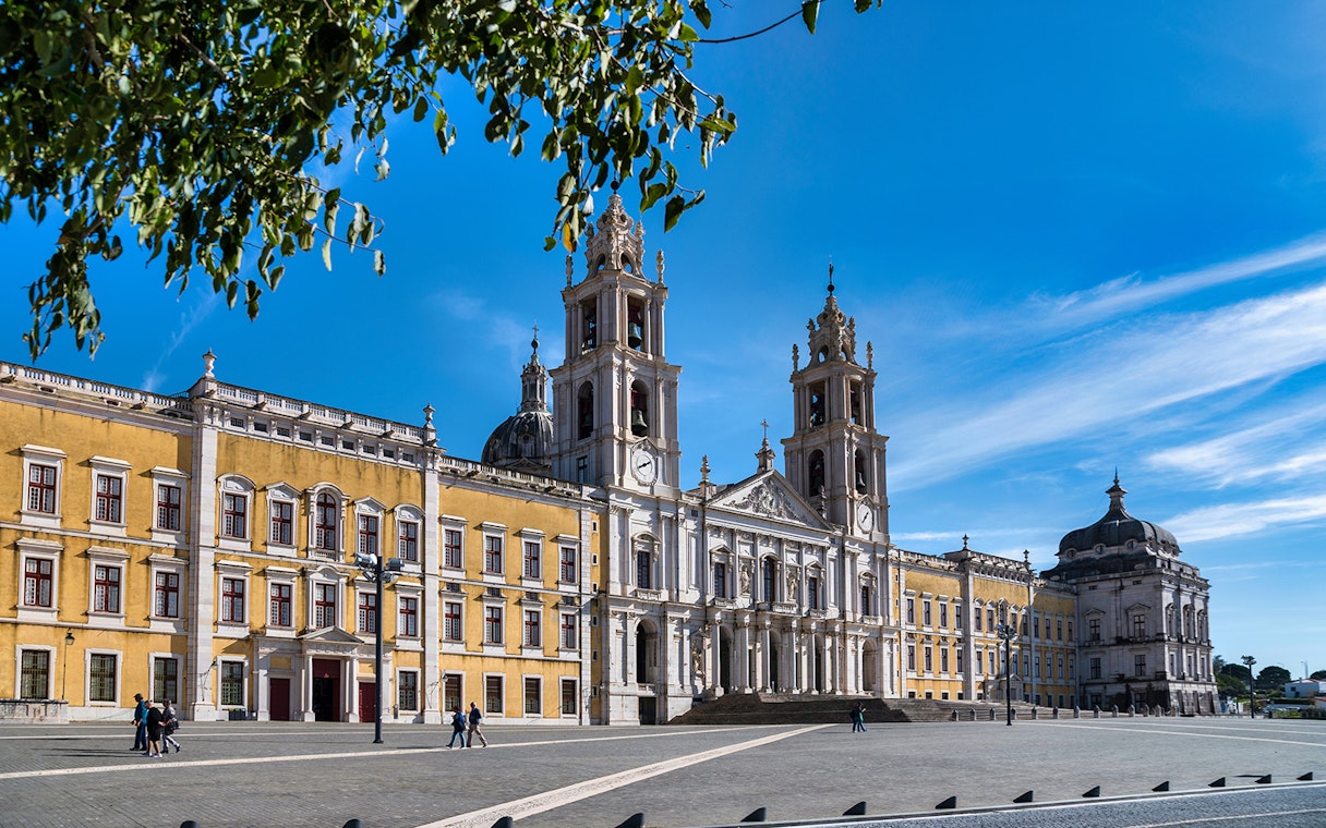 Mafra National Palace facade with twin bell towers in Mafra, Portugal.