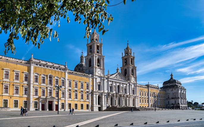 Mafra National Palace facade with twin bell towers in Mafra, Portugal.