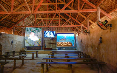 Film room with benches and screens at Cu Chi Tunnels, Vietnam.