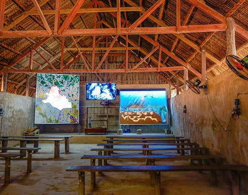 Film room with benches and screens at Cu Chi Tunnels, Vietnam.