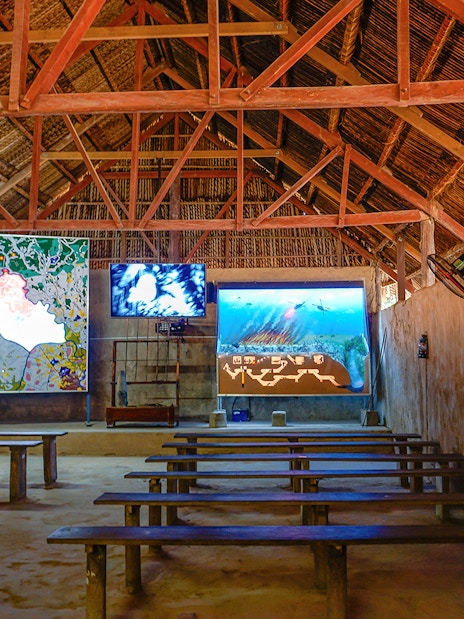 Film room with benches and screens at Cu Chi Tunnels, Vietnam.