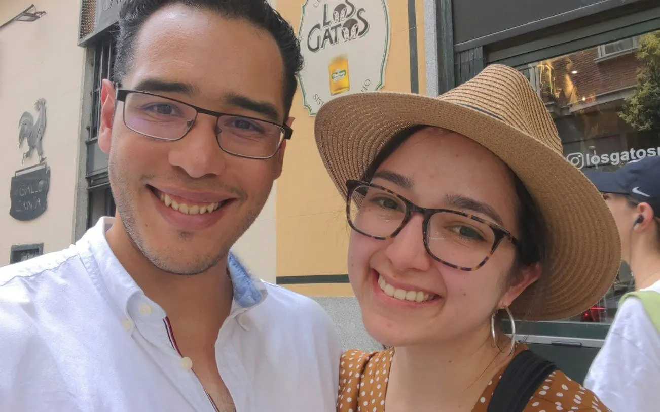 I don't know who these people are, but they are smiling in front of a Madrid café sign during the Ghosts of Madrid tour.