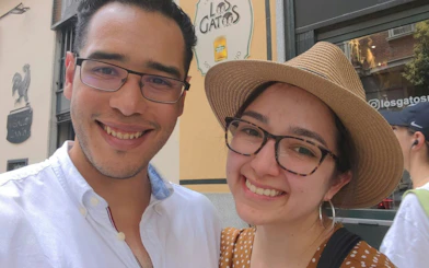 I don't know who these people are, but they are smiling in front of a Madrid café sign during the Ghosts of Madrid tour.