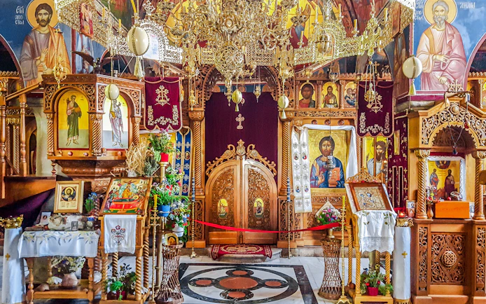 Interior of Tvrdos Monastery with ornate icons and wooden carvings, Trebinje, Bosnia and Herzegovina.