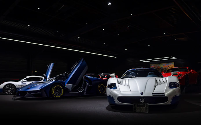 Luxury sports cars displayed at Coligny Car Museum, Lyon, France.