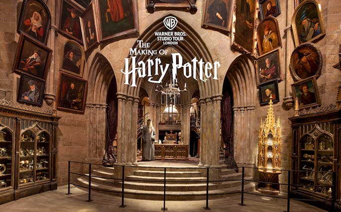 Dumbledore's office set at Warner Bros Studio Tour London, featuring portraits and magical artifacts.