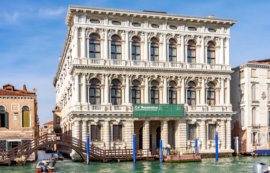 Ca' Rezzonico museum facade along the Grand Canal in Venice.