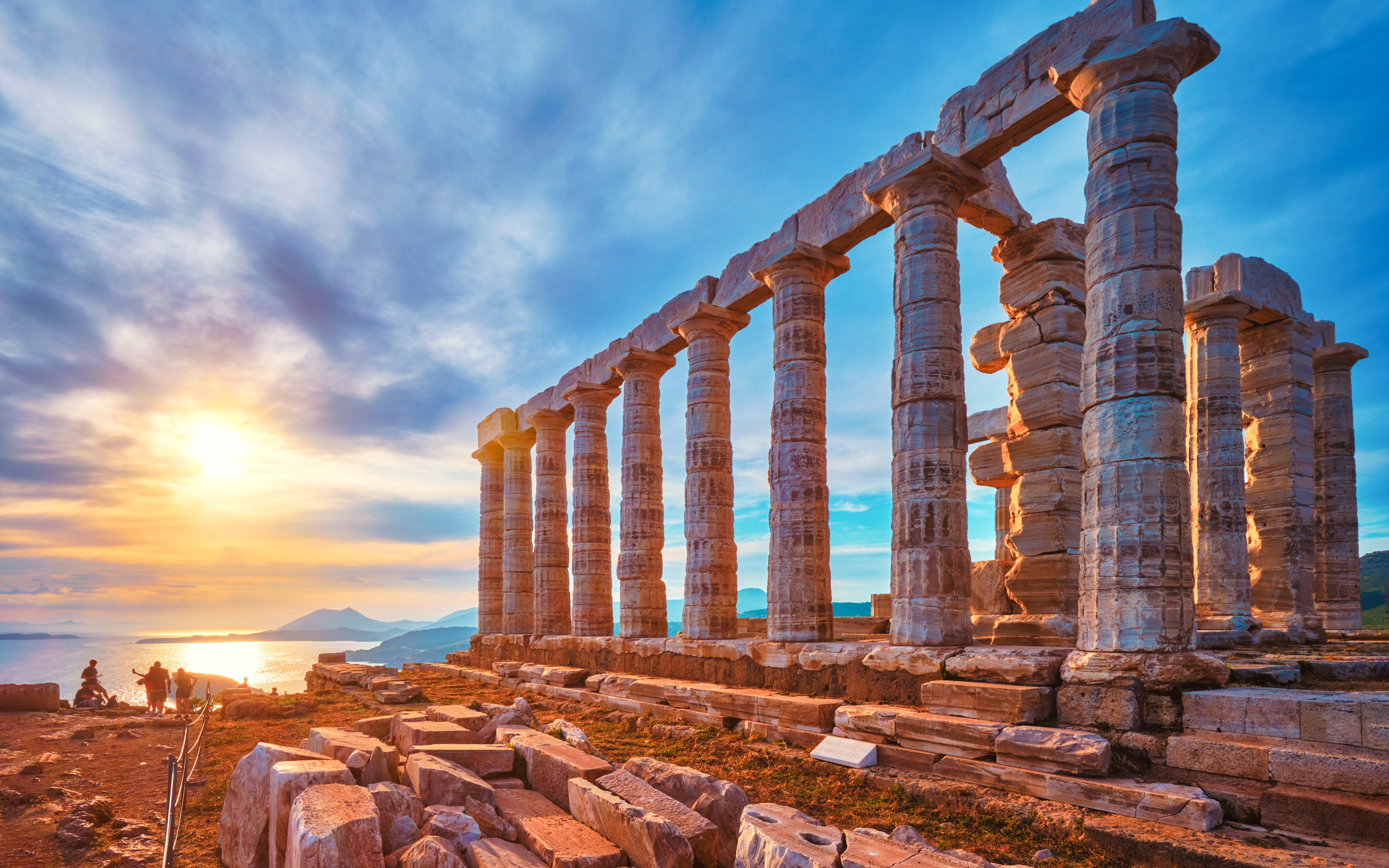 Temple of Poseidon with sunset over the Aegean Sea, Greece.
