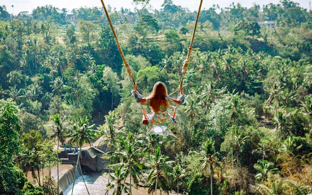 Jungle swing overlooking lush forest in Ubud, part of the Gorilla Face ATV Adventure tour.