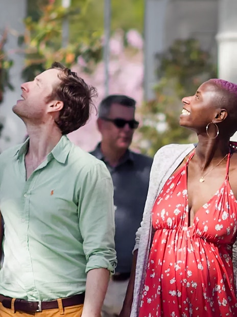 Visitors enjoying the greenery at Kew Gardens.