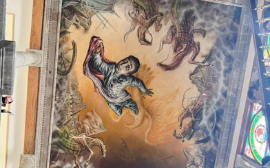 Mural on Chapultepec Castle ceiling depicting a historical scene with a central figure and horses, Mexico City.