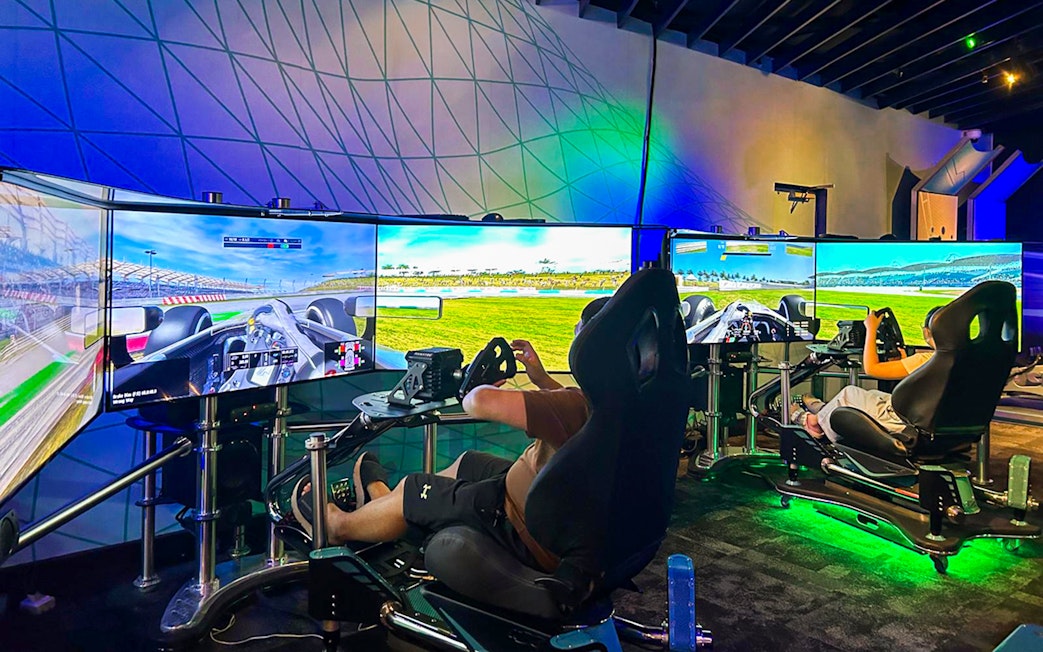 Visitors using racing simulators at Petrosains, The Discovery Centre in Kuala Lumpur.