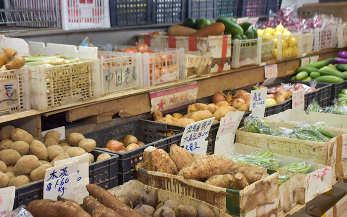 Market stall with fresh vegetables and root crops for Market to Table Culinary Tour.