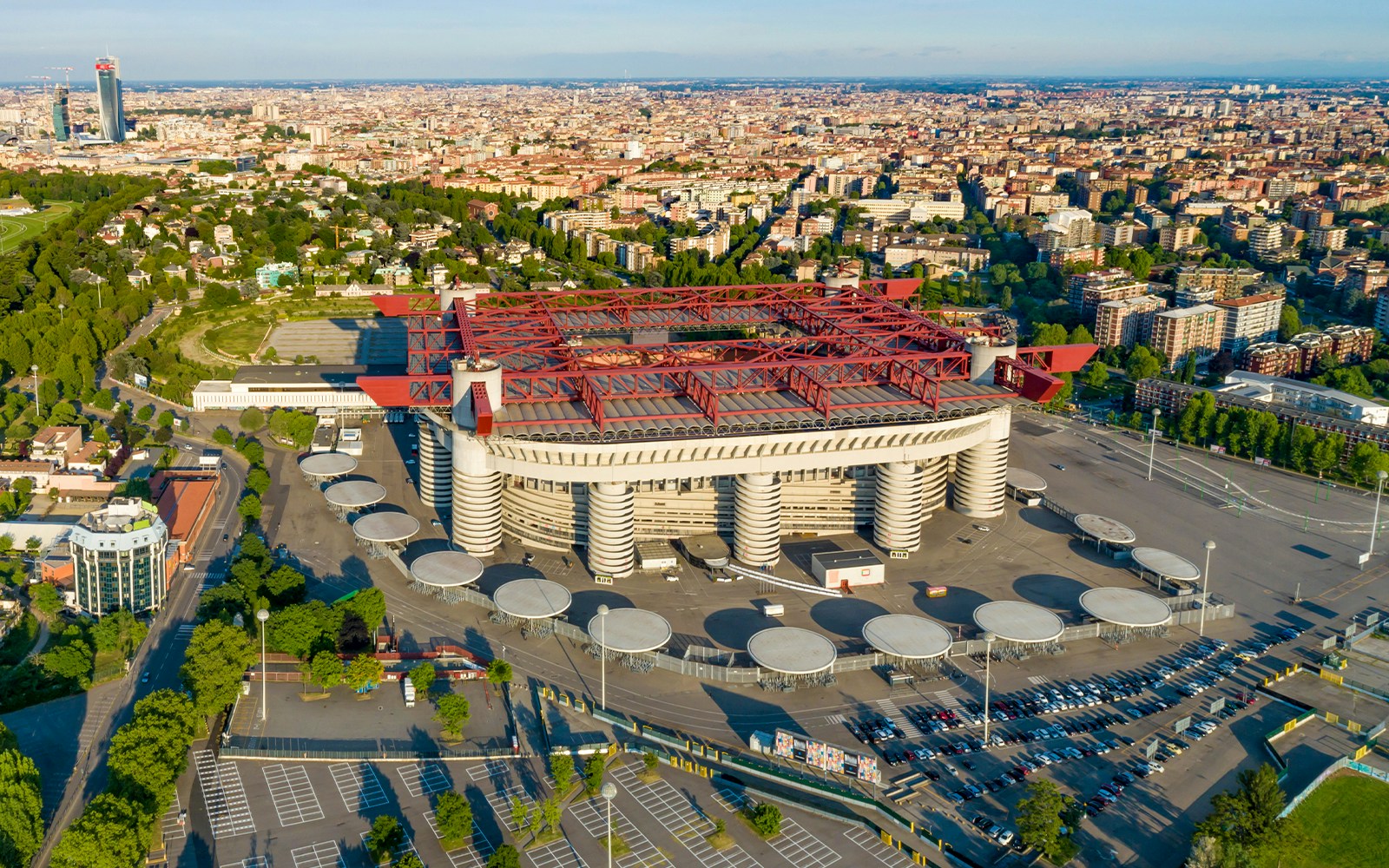 San Siro Stadium in Milan with a view of the iconic red roof and seating area.