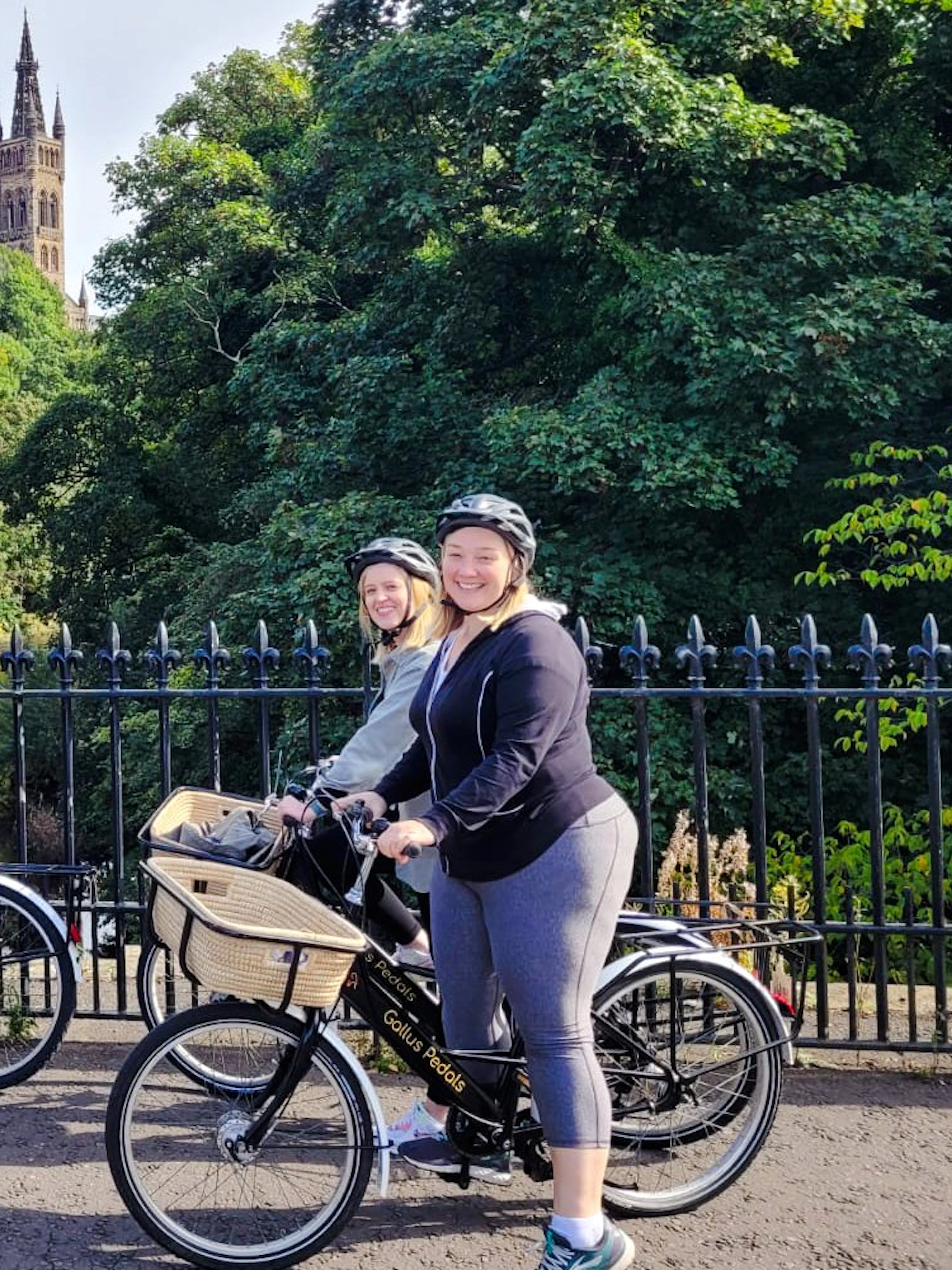 Guests biking near Glasgow University on the Glasgow Highlights Bike Tour.