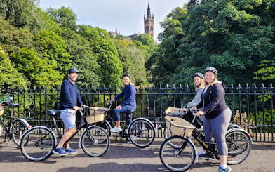 Guests biking near Glasgow University on the Glasgow Highlights Bike Tour.
