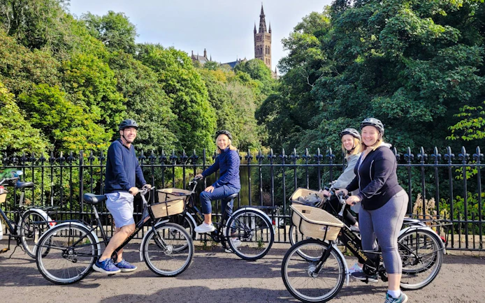 Guests biking near Glasgow University on the Glasgow Highlights Bike Tour.